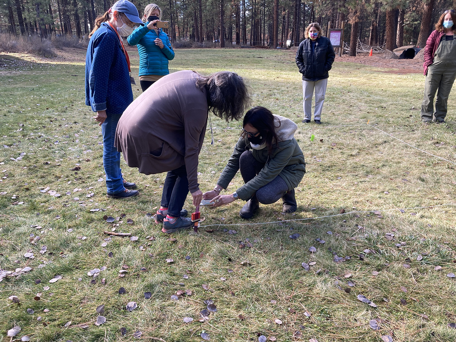 Teachers attach a SensorTag to capture data above the pervious surface.