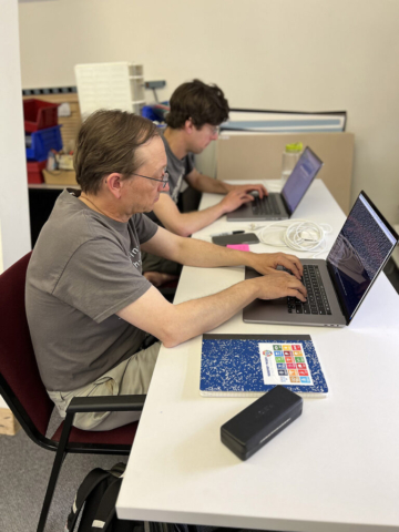 Two developers working at their laptops