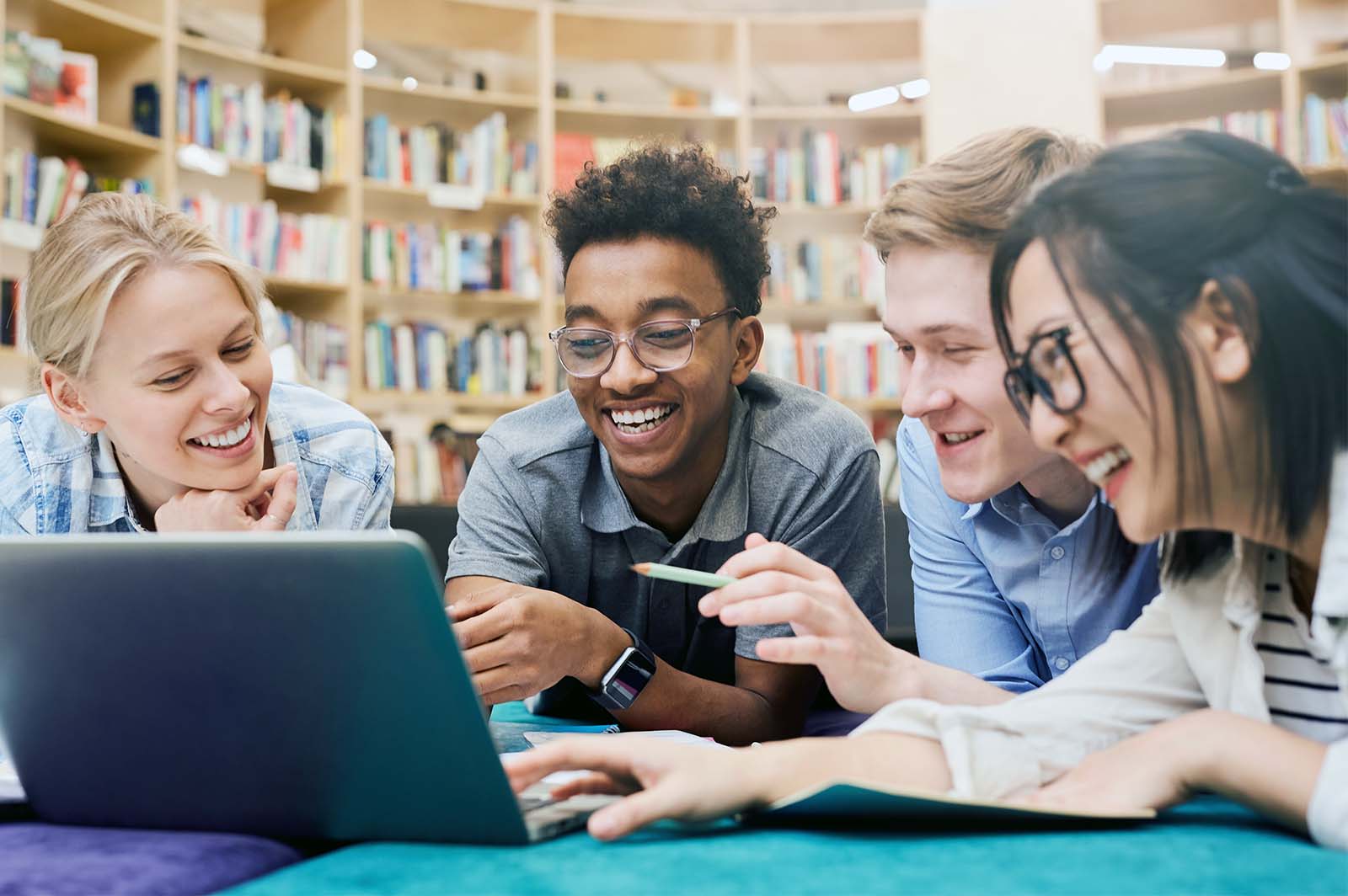 Four students collaborating on a computer-based activity